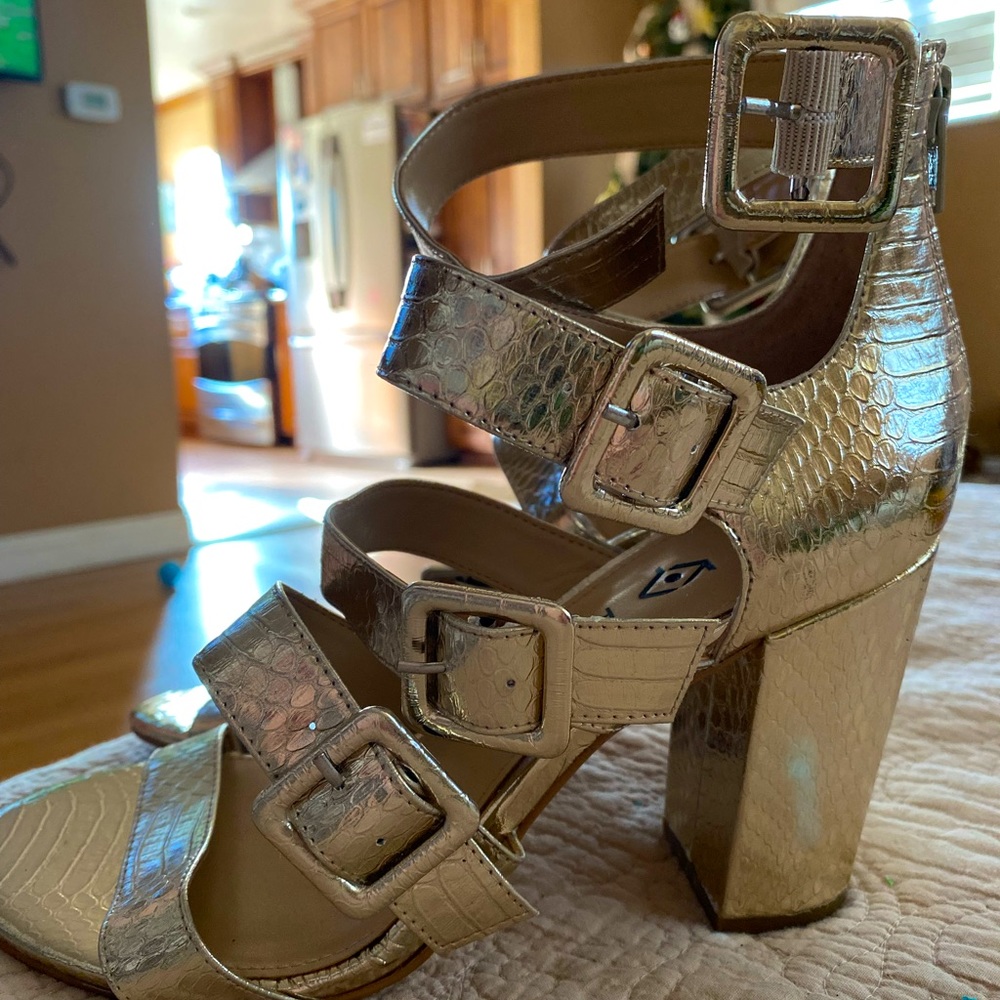Katy Perry golden snakeskin heels.